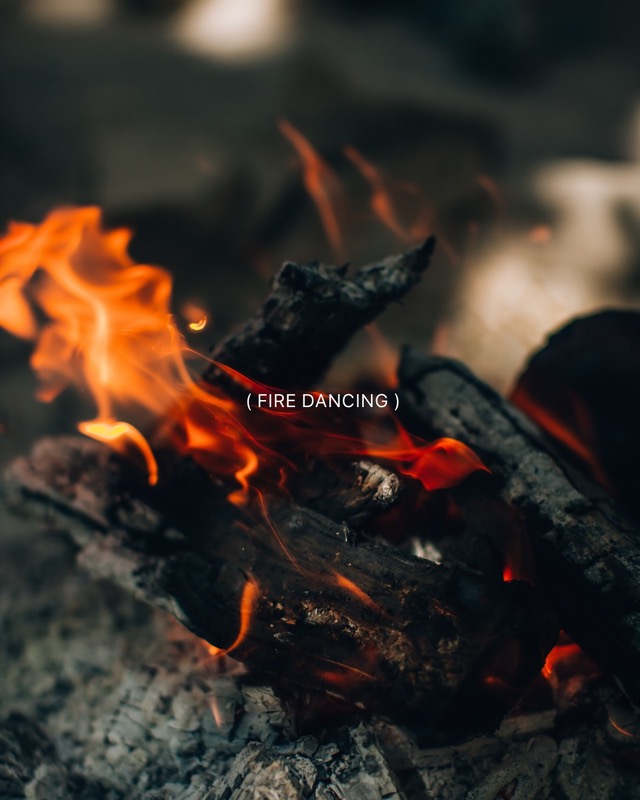 Flames rise from glowing logs, with the words “Fire dancing”.